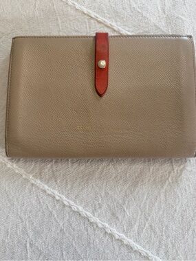 Celine taupe leather wallet with red strap and gold-tone snap